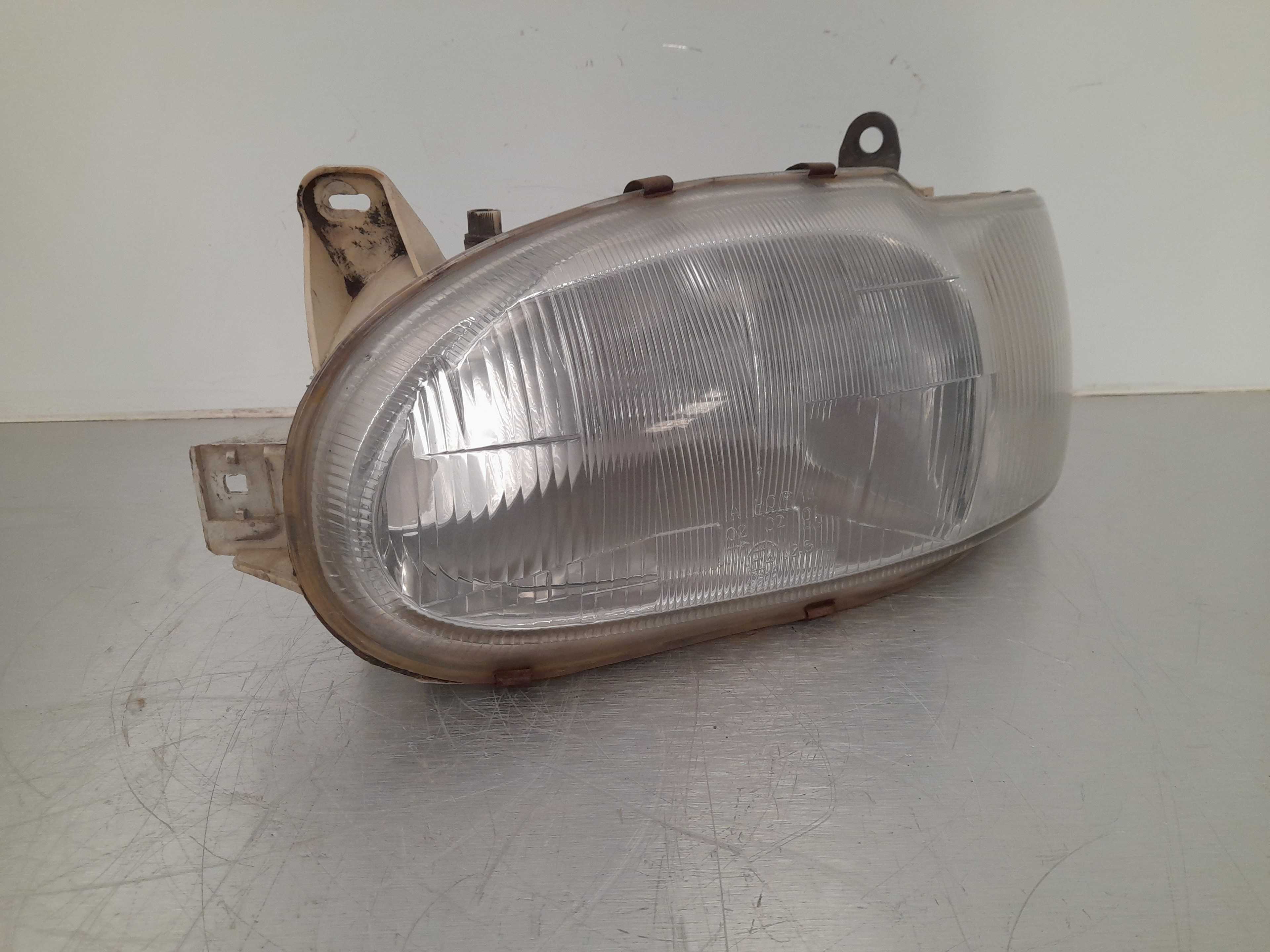 Recambio de faro izquierdo para ford escort berlina referencia OEM IAM 084311126  