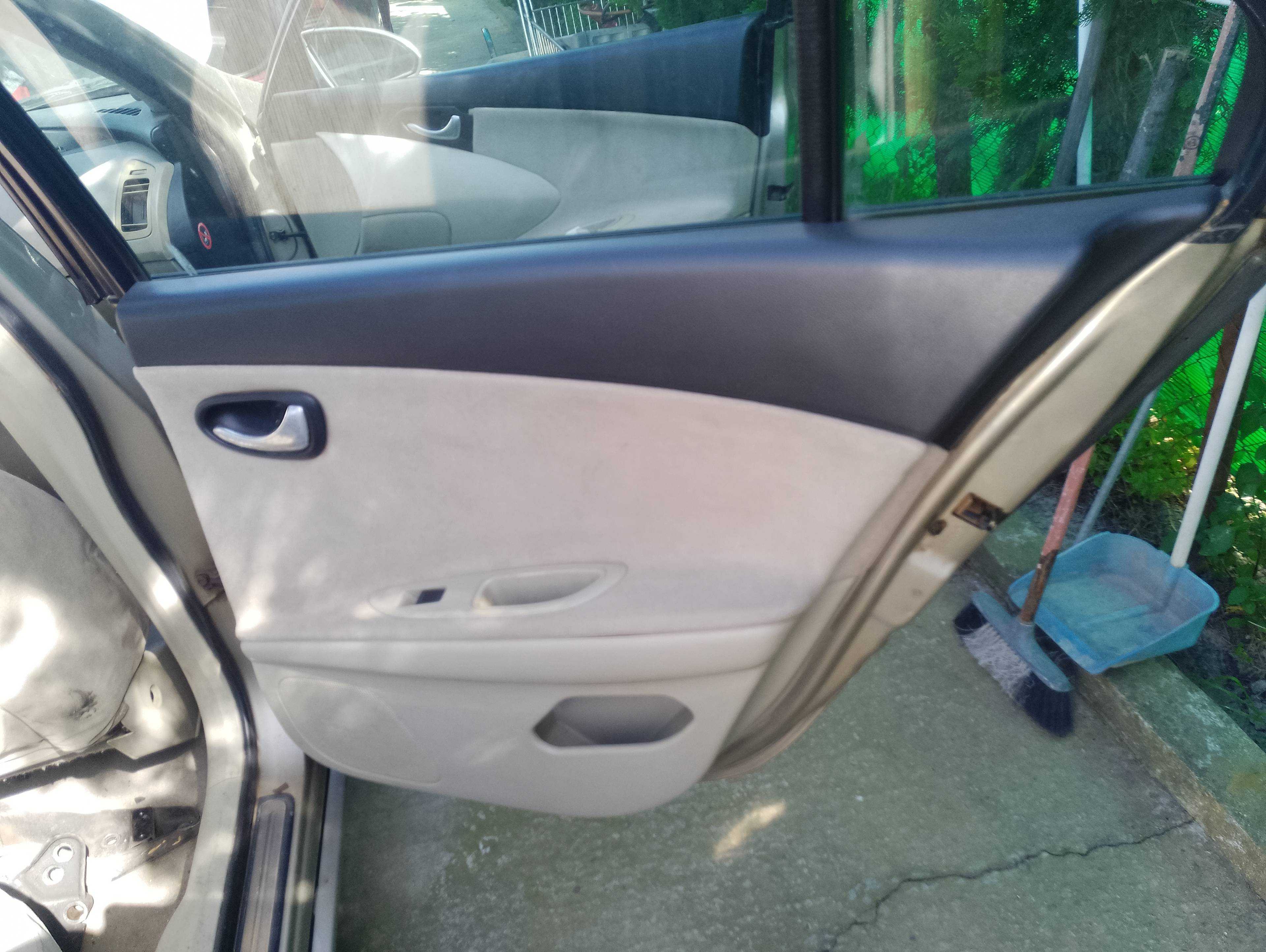 Recambio de guarnecido puerta trasera derecha para nissan primera berlina (p12) acenta referencia OEM IAM   