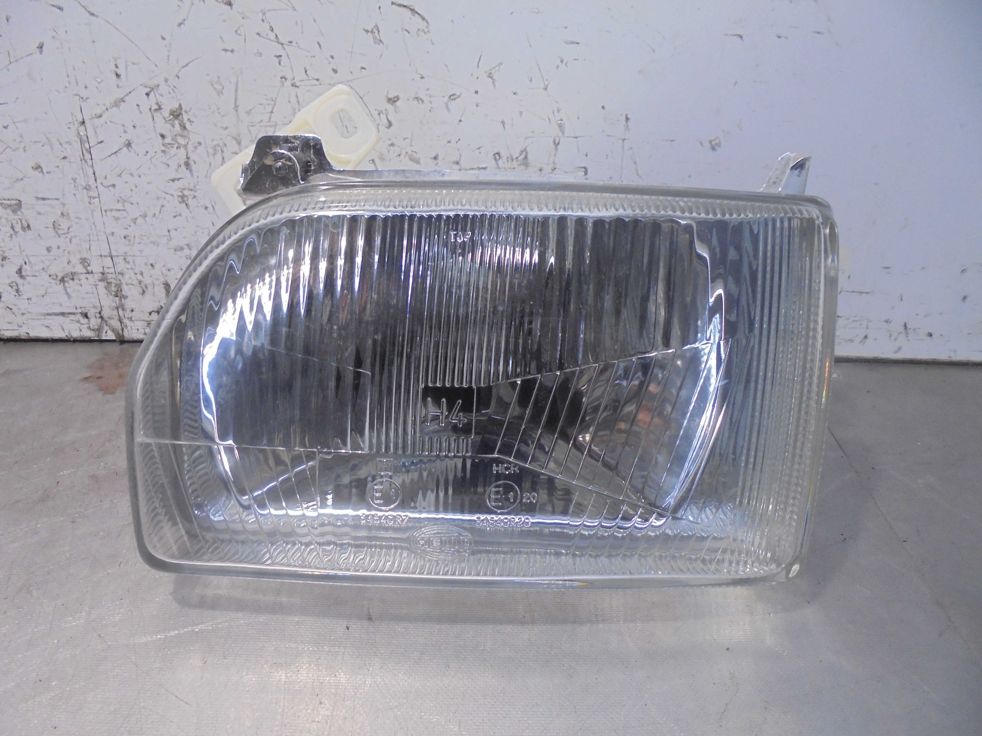 Recambio de faro izquierdo para ford orion referencia OEM IAM 97AX13006AA HELLA 