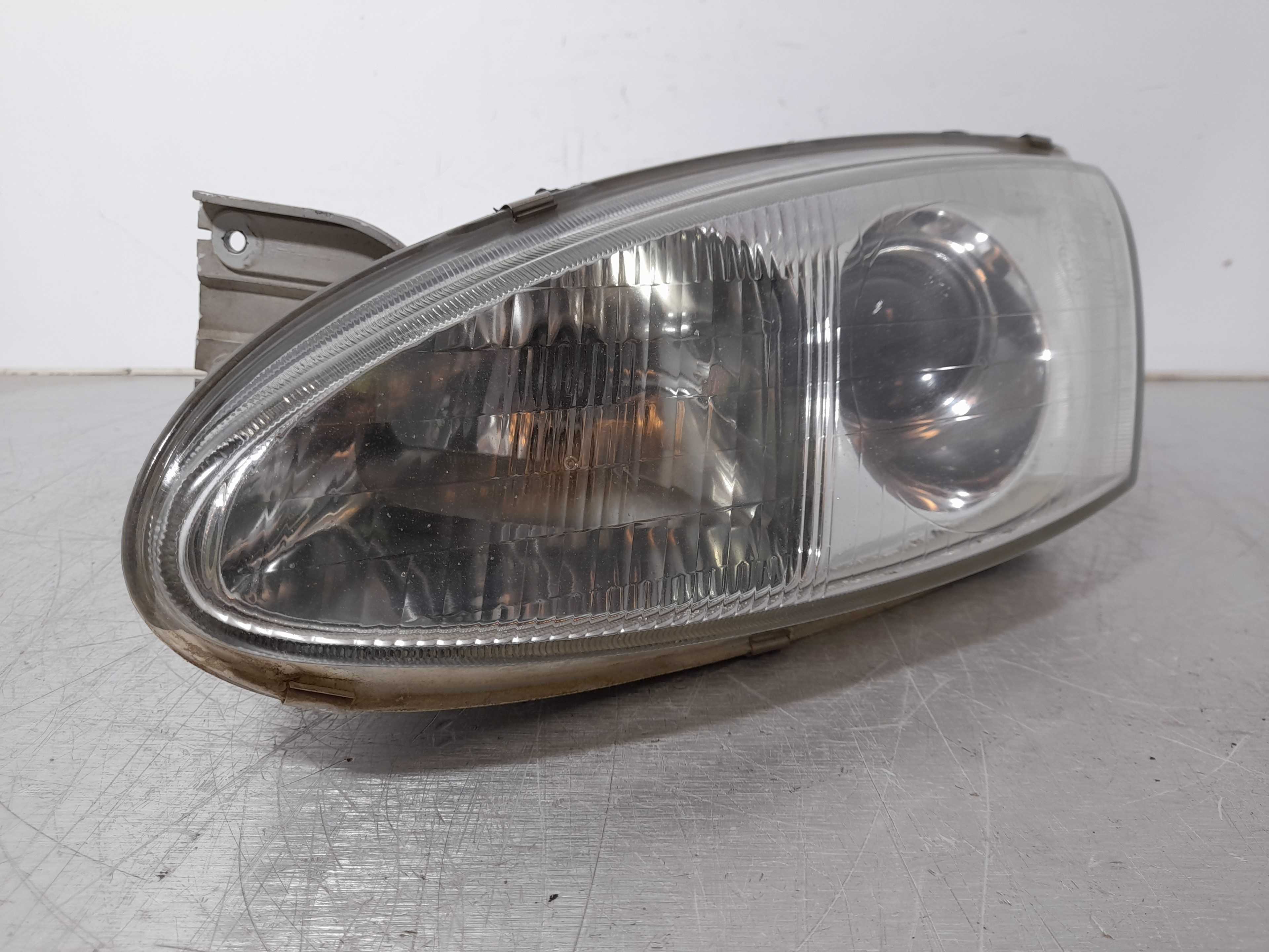 Recambio de faro izquierdo para hyundai coupe (j2) 1.6 fx coupe referencia OEM IAM 1010495  